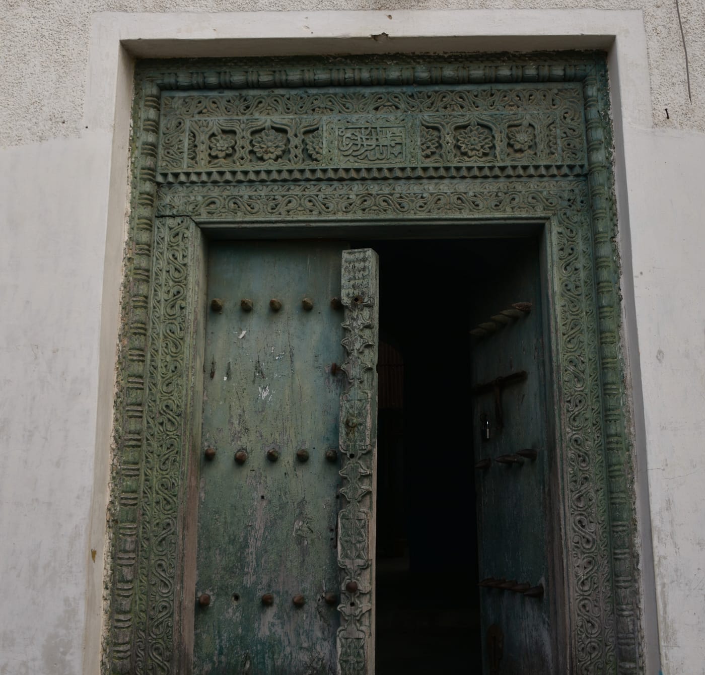 Carved wooden Zanzibari door with brass studs in Stone Town