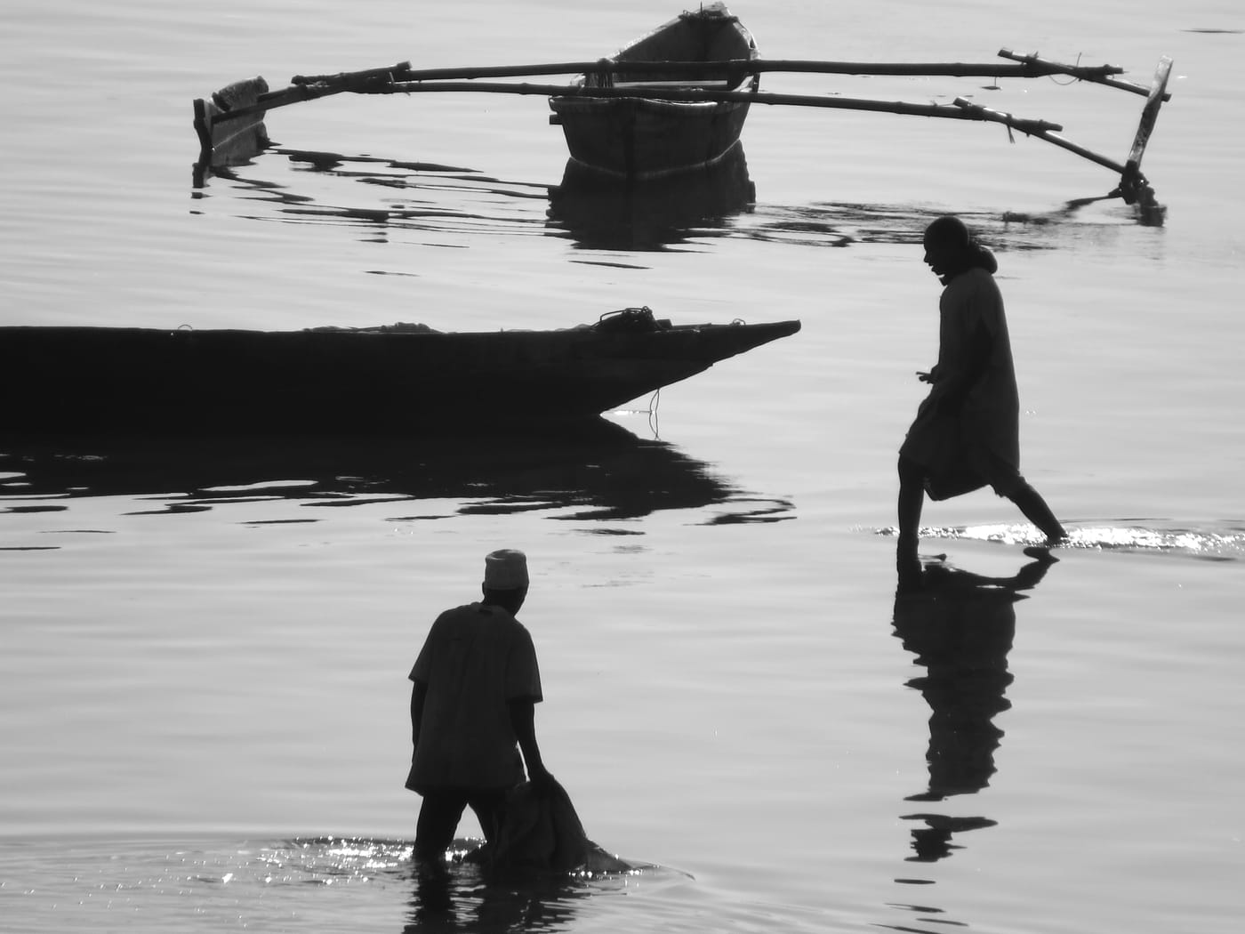 Fishermen at dawn on the shore at Malindi, Zanzibar