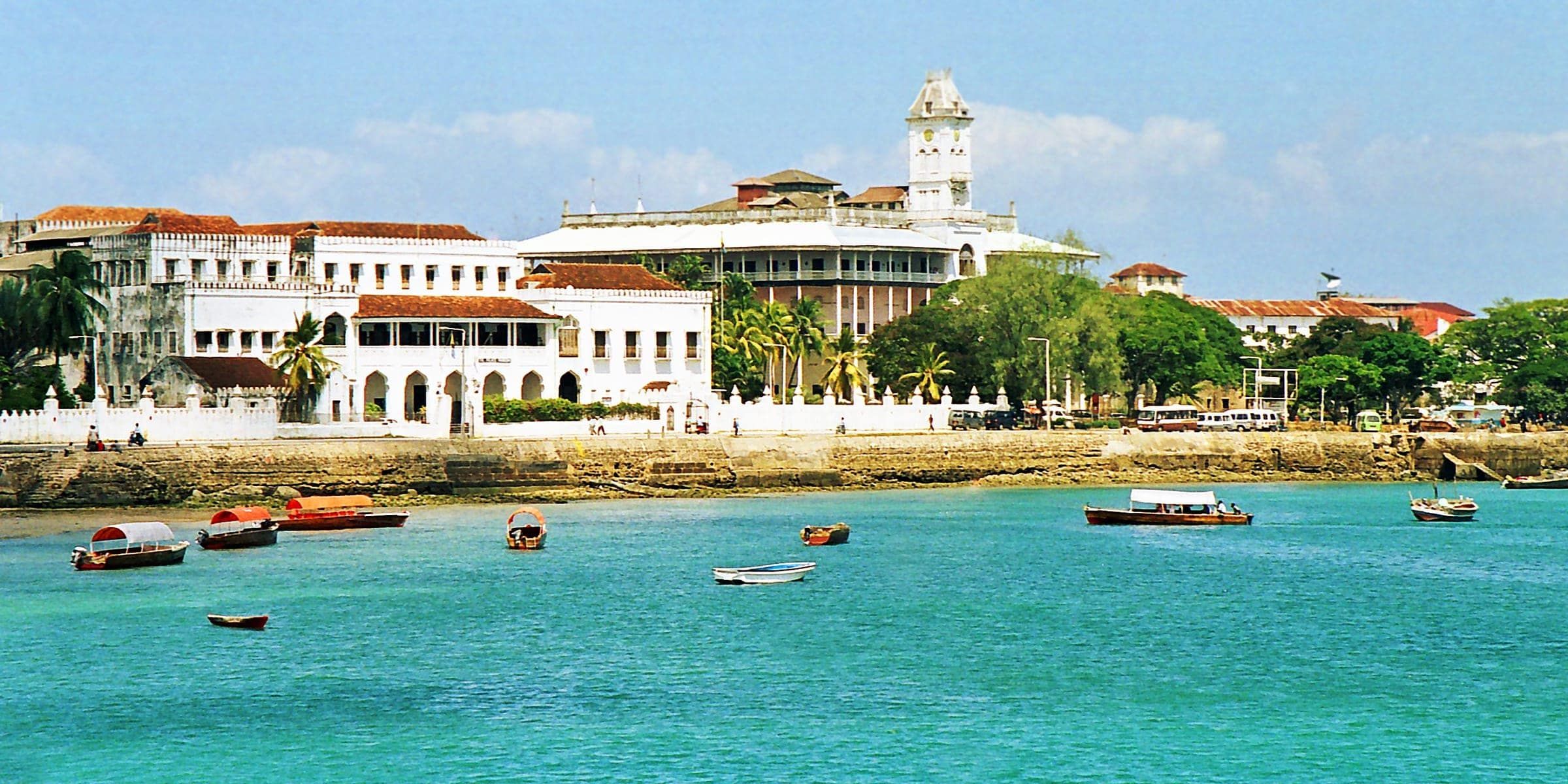Dhows on the turquoise water in front of the Stone Town seafront, Zanzibar