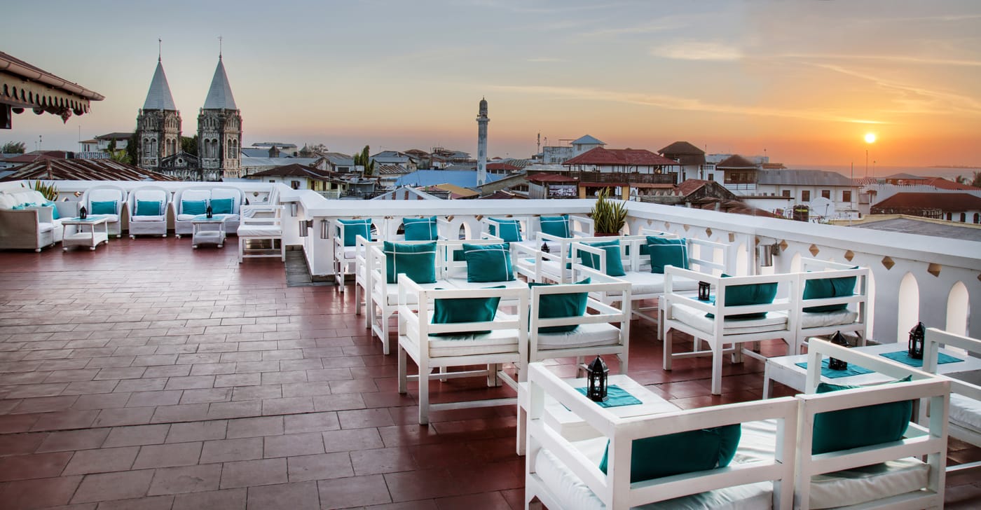 A restored merchant house hotel with carved balconies in Stone Town, Zanzibar